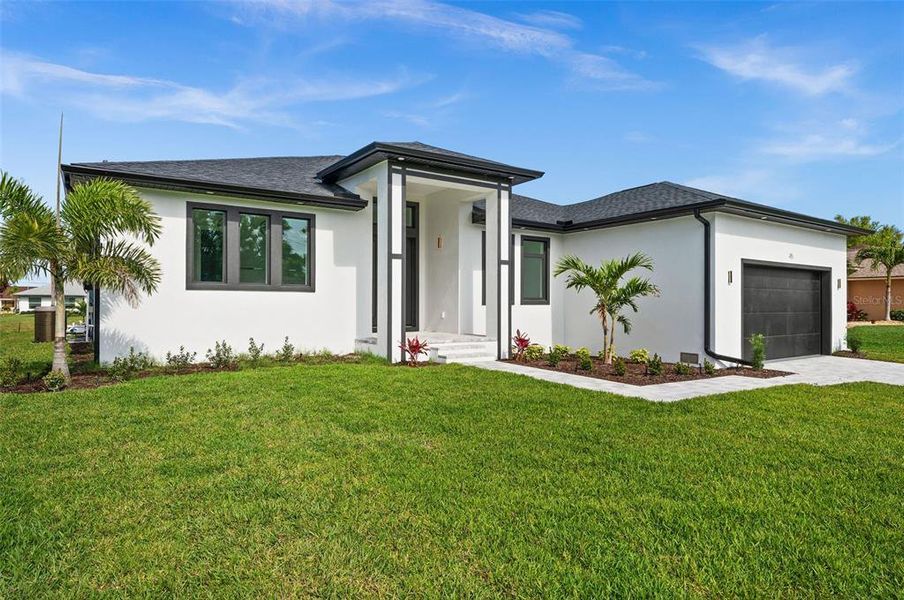 Front exterior of a new home in , Rotonda West, FL, highlighting curb appeal (Image 20).
