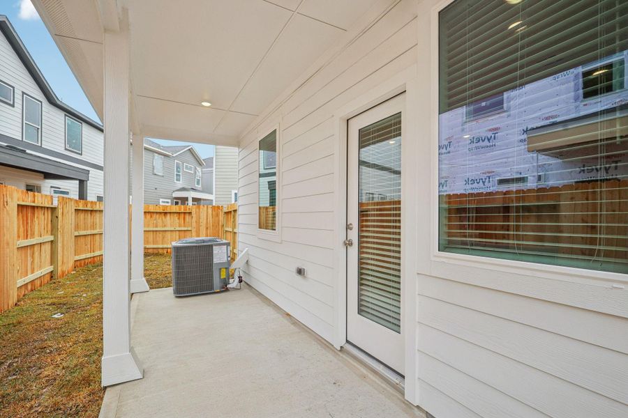 Exterior details and patio area of a home in Pinewood Trails - City Series, Atascocita (Image 3).