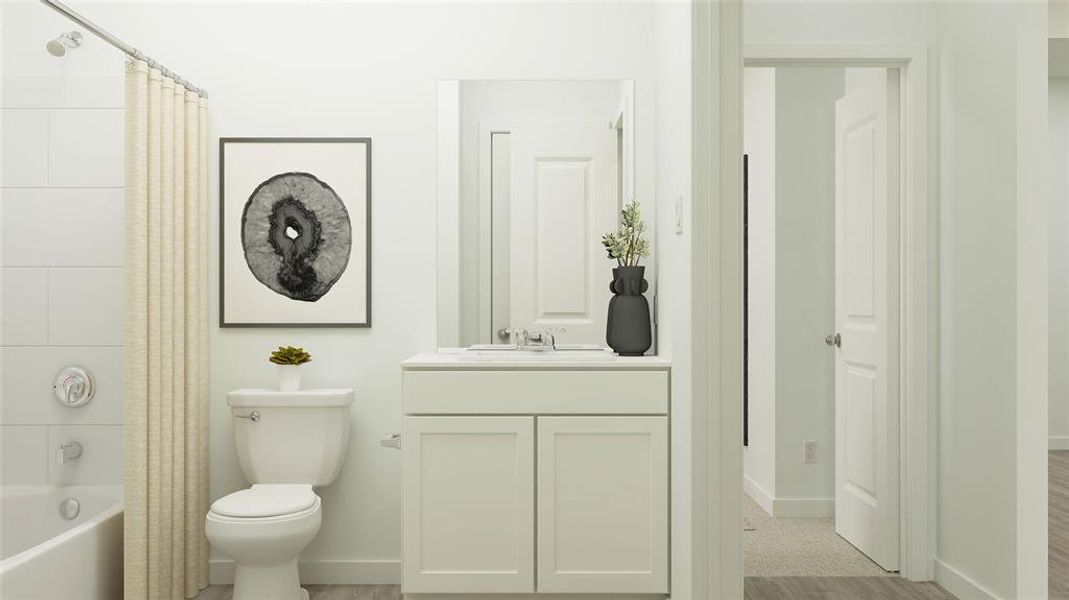 Full bathroom featuring hardwood / wood-style flooring, vanity, toilet, and shower / tub combo with curtain