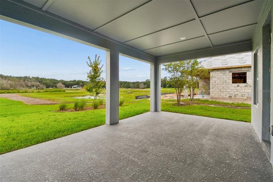 Exterior details and patio area of a home in Oakfield at Mount Dora Village Series, Mount Dora (Image 3).
