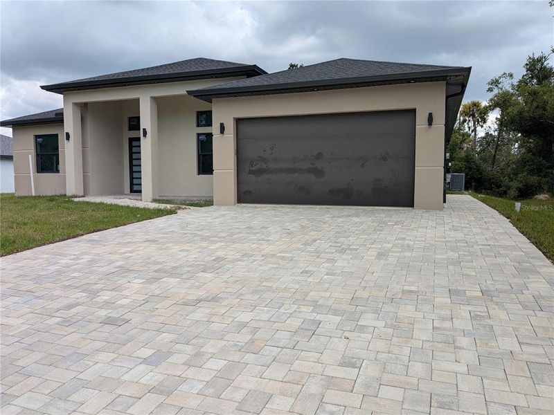 Front exterior of a new home in , Port Charlotte, FL, highlighting curb appeal (Image 35).
