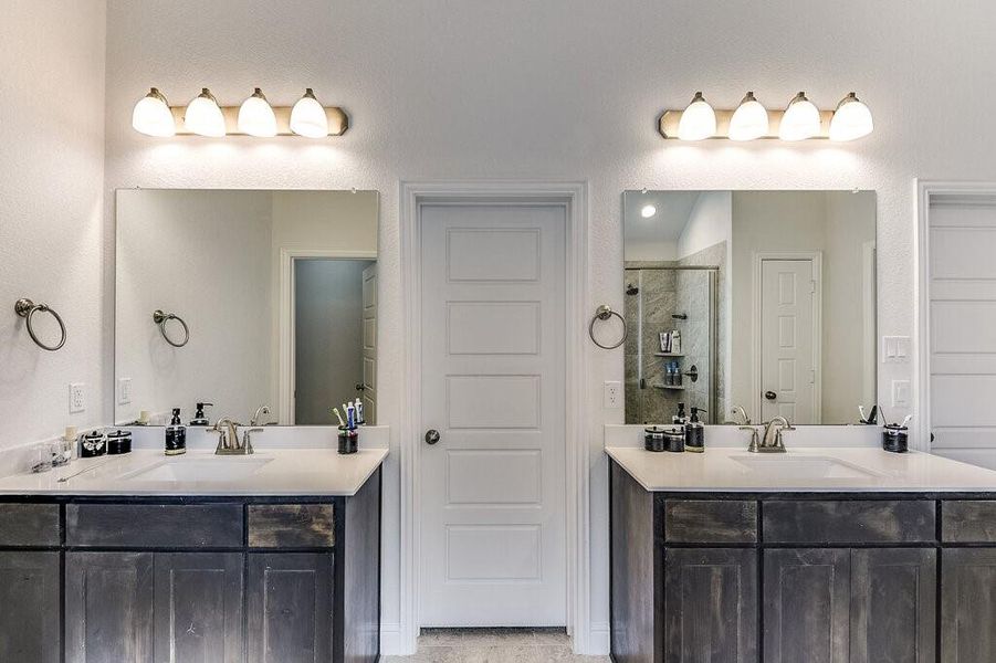 Having two separate vanities is ideal for getting ready for work in the mornings.