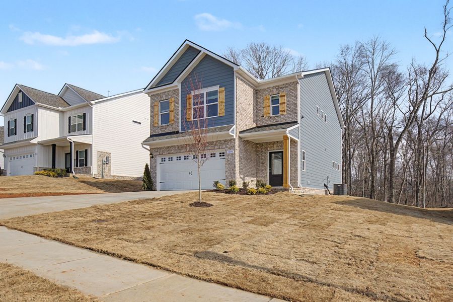 Front exterior of a new home in The Oaks, Clarksville, TN, highlighting curb appeal (Image 15).