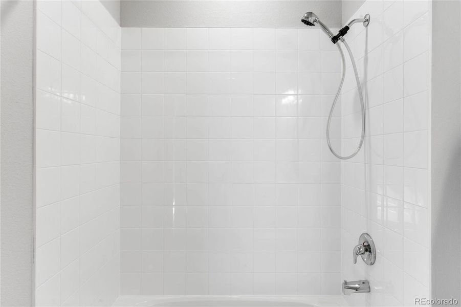 The second full bathroom shower, with tub