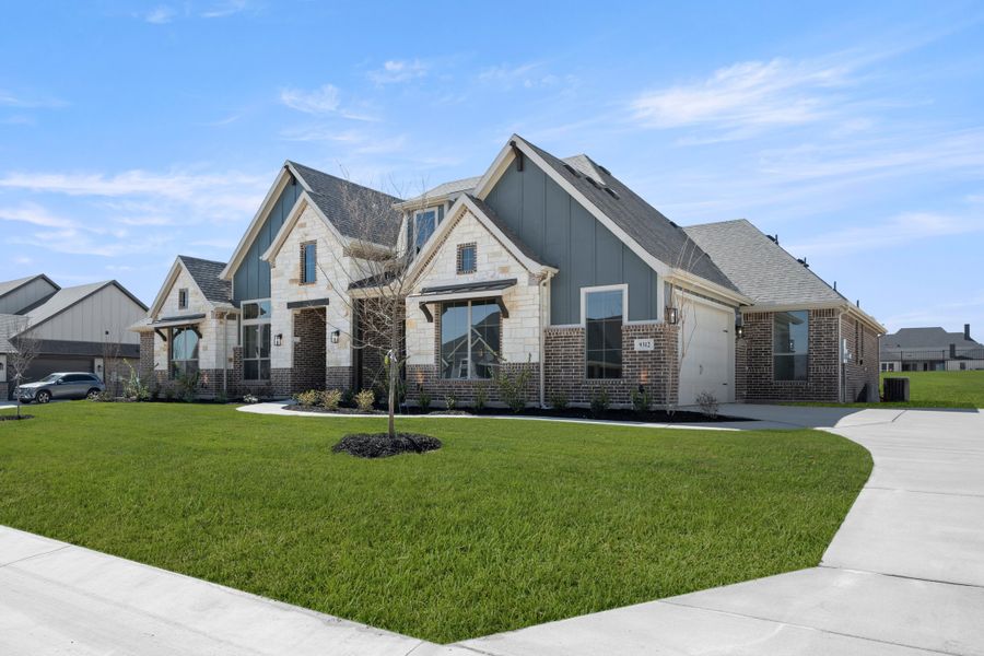 Front exterior of a new home in Paloma Ranch, Justin, TX, highlighting curb appeal (Image 18).