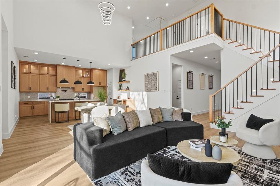 Living area with recessed lighting and light wood-style floors