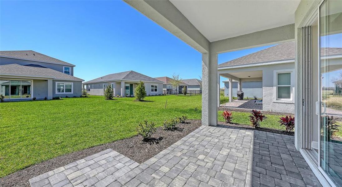 Front exterior of a new home in Wildleaf, Parrish, FL, highlighting curb appeal (Image 18).