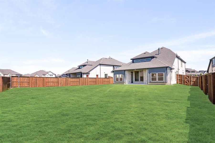 Exterior details and patio area of a home in Windsong Ranch Classic 61, Prosper (Image 3). Exterior details and patio area of a home in Windsong Ranch Classic 61, Prosper (Image 3).