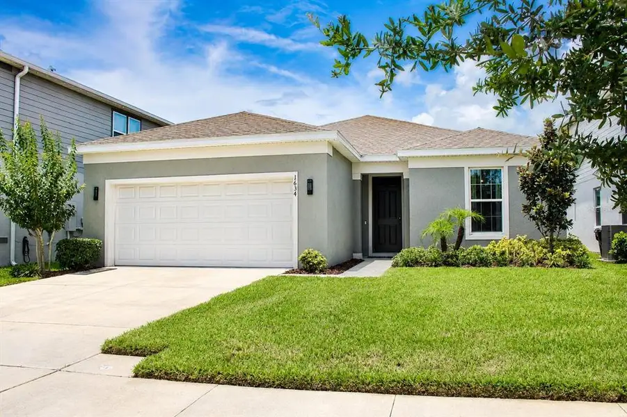 Front exterior of a new home in , St. Cloud, FL, highlighting curb appeal (Image 20).