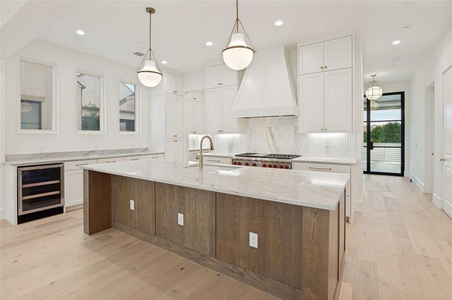 Organic wood cabinetry brings texture and sophistication to the island kitchen