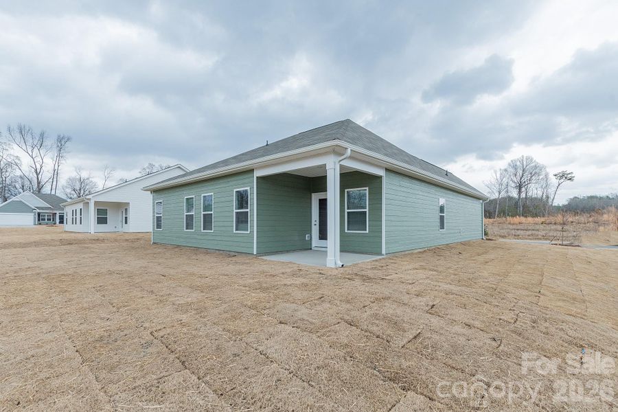 Exterior details and patio area of a home in Pine Bluff, Midland (Image 4). Exterior details and patio area of a home in Pine Bluff, Midland (Image 4).
