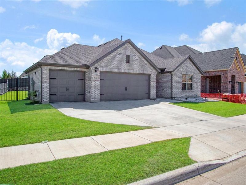 Front exterior of a new home in , Venus, TX, highlighting curb appeal (Image 18).