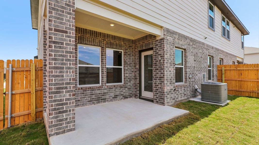 Exterior details and patio area of a home in Palomino, Manor (Image 4).
