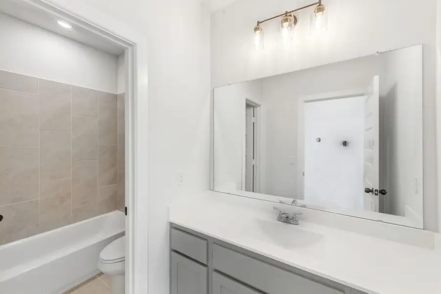 Furnished interior view inside a new home in The Colony - 50', Bastrop (Image 6).