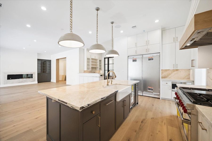 Kitchen is fully equiped with Wolf/SubZero appliances. Large island open to the family room with impressive fireplace. Kitchen is fully equiped with Wolf/SubZero appliances. Large island open to the family room with impressive fireplace.