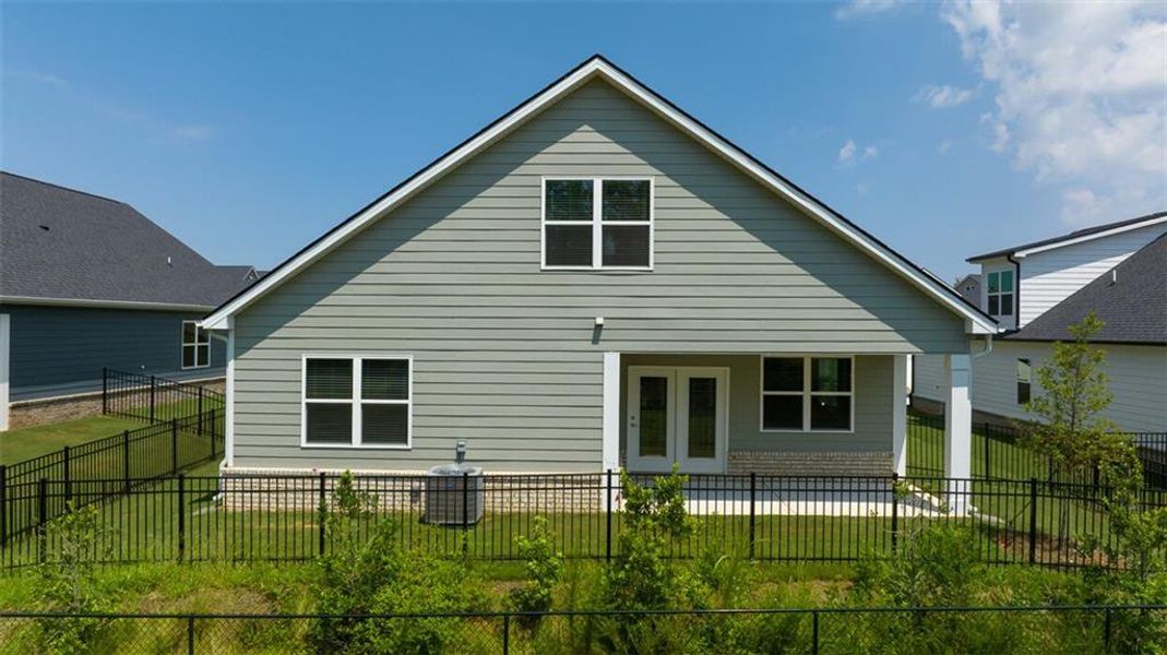 Exterior details and patio area of a home in Oak Ridge Meadows - Active Adult, Locust Grove (Image 3).