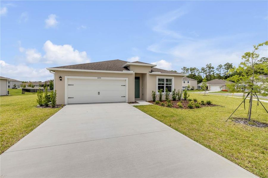 Front exterior of a new home in , New Smyrna Beach, FL, highlighting curb appeal (Image 2). Front exterior of a new home in , New Smyrna Beach, FL, highlighting curb appeal (Image 2).