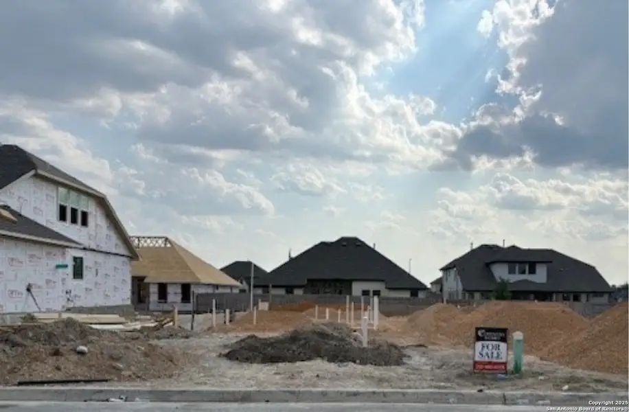 Front exterior of a new home in Buffalo Crossing, Cibolo, TX, highlighting curb appeal (Image 2).