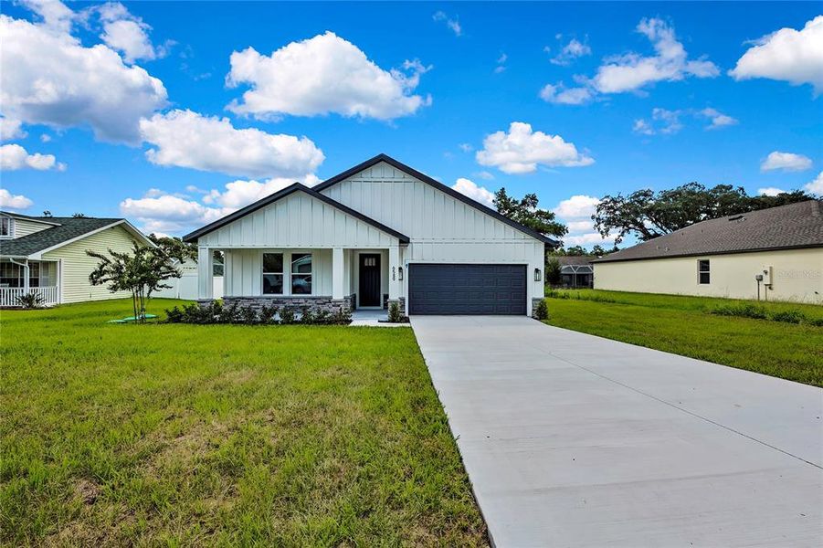 Front exterior of a new home in , Spring Hill, FL, highlighting curb appeal (Image 27). Front exterior of a new home in , Spring Hill, FL, highlighting curb appeal (Image 27).