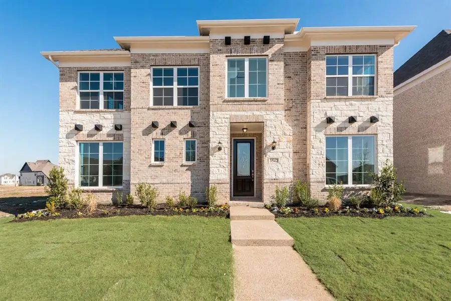 Front exterior of a new home in Prairie Ridge, Midlothian, TX, highlighting curb appeal (Image 1).