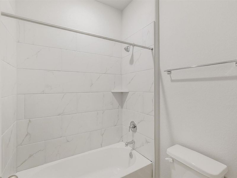 Furnished interior view inside a new home in Sunterra, Katy (Image 14).