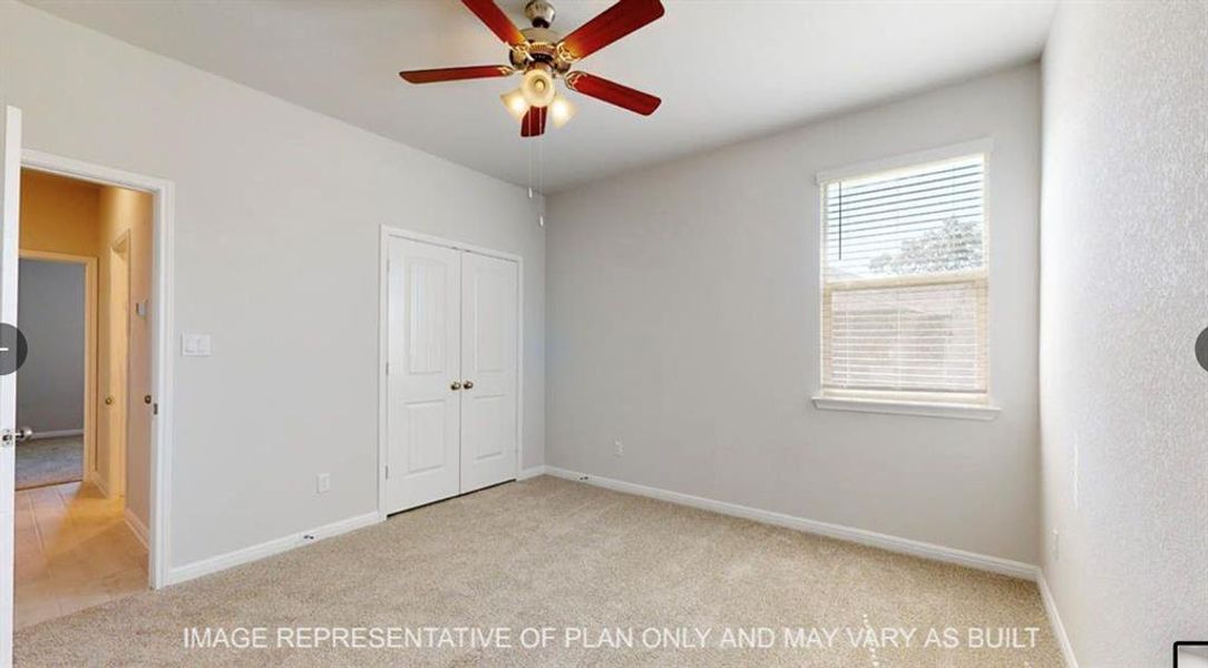 Unfurnished bedroom with baseboards, ceiling fan, a closet, and light colored carpet Unfurnished bedroom with baseboards, ceiling fan, a closet, and light colored carpet