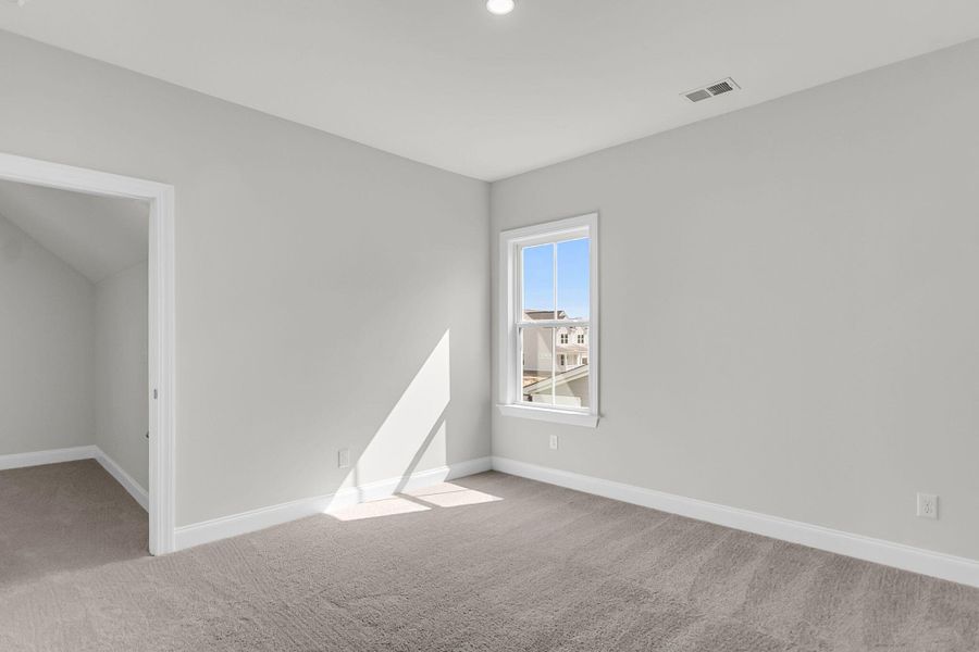 Spacious, unfurnished interior of a new home in Tidewater at Lakes of Cane Bay, Summerville (Image 30).