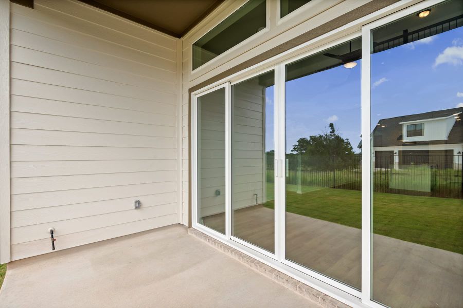 Exterior details and patio area of a home in Lariat, Liberty Hill (Image 25).