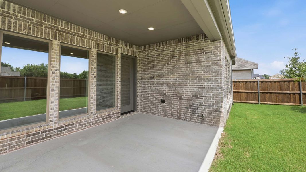 Exterior details and patio area of a home in Trinity Falls, McKinney (Image 4). Exterior details and patio area of a home in Trinity Falls, McKinney (Image 4).
