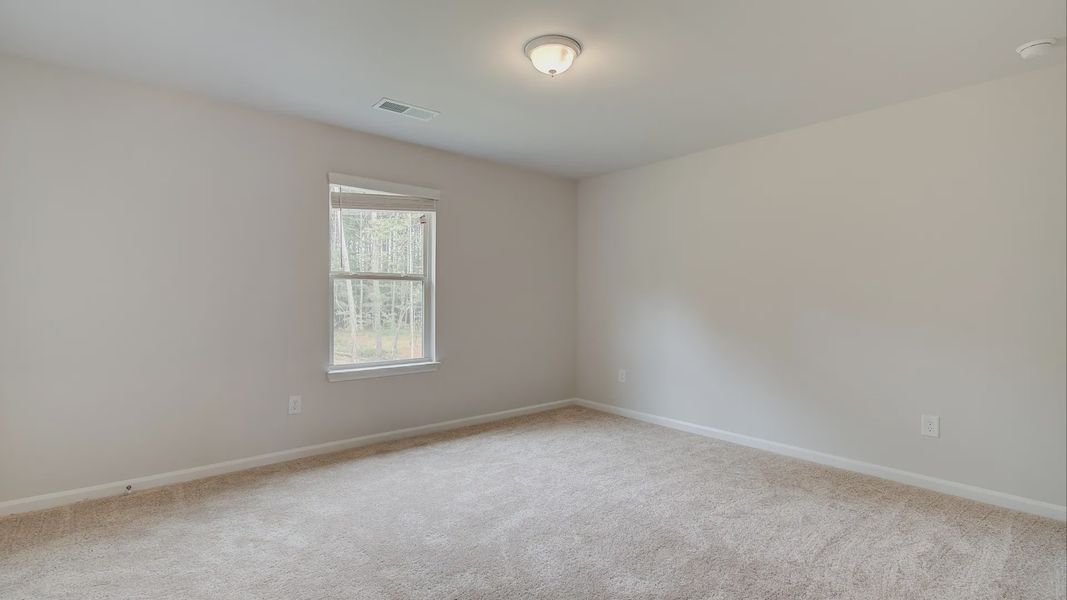 Representative furnished interior of a home built from the Meridian II by DRB Homes in Northcroft, Loganville (Image 25).