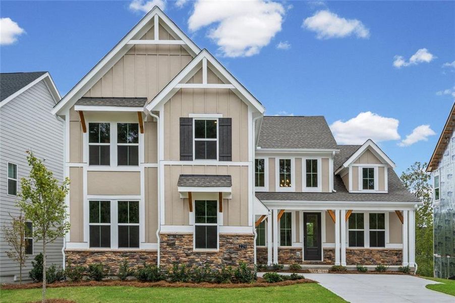 Front exterior of a new home in Twin Lakes, Hoschton, GA, highlighting curb appeal (Image 19). Front exterior of a new home in Twin Lakes, Hoschton, GA, highlighting curb appeal (Image 19).