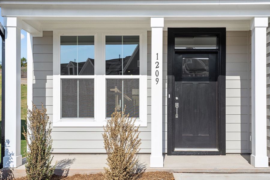 Exterior details and patio area of a home in Ovation at Sweetbrier, Durham (Image 3).