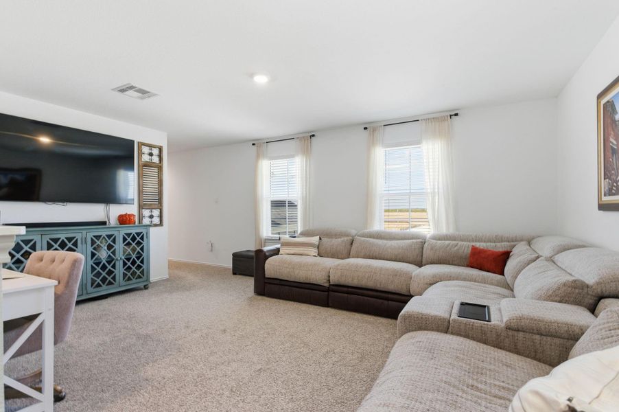 Upstairs game room offering extra space for relaxation or entertainment. Upstairs game room offering extra space for relaxation or entertainment.