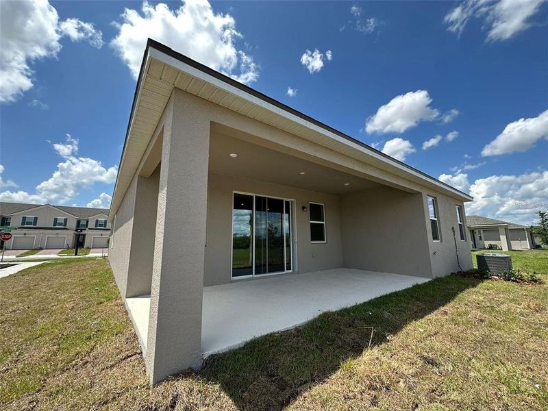 Front exterior of a new home in Soleil, Kissimmee, FL, highlighting curb appeal (Image 17).