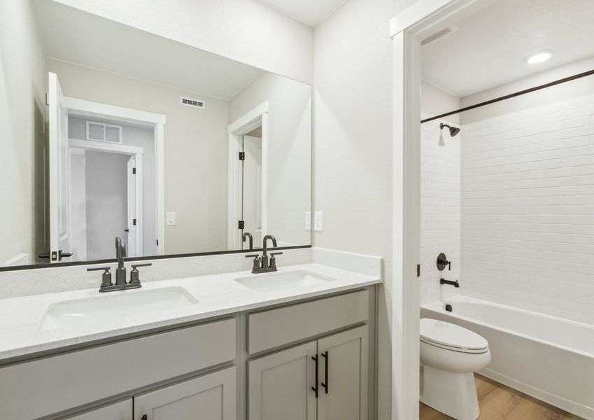 The secondary bathroom has a tub/shower combo.