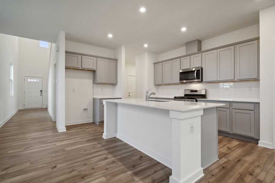 A kitchen with white cabinets. A kitchen with white cabinets.