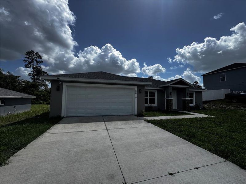 Front exterior of a new home in , Ocala, FL, highlighting curb appeal (Image 4). Front exterior of a new home in , Ocala, FL, highlighting curb appeal (Image 4).