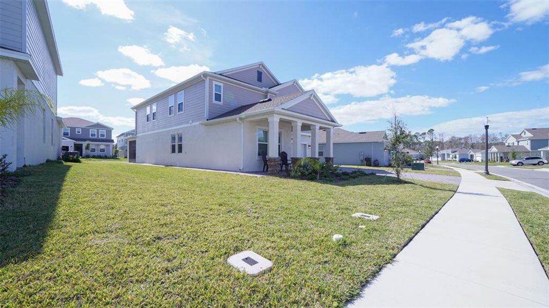 Front exterior of a new home in Providence, Davenport, FL, highlighting curb appeal (Image 23). Front exterior of a new home in Providence, Davenport, FL, highlighting curb appeal (Image 23).