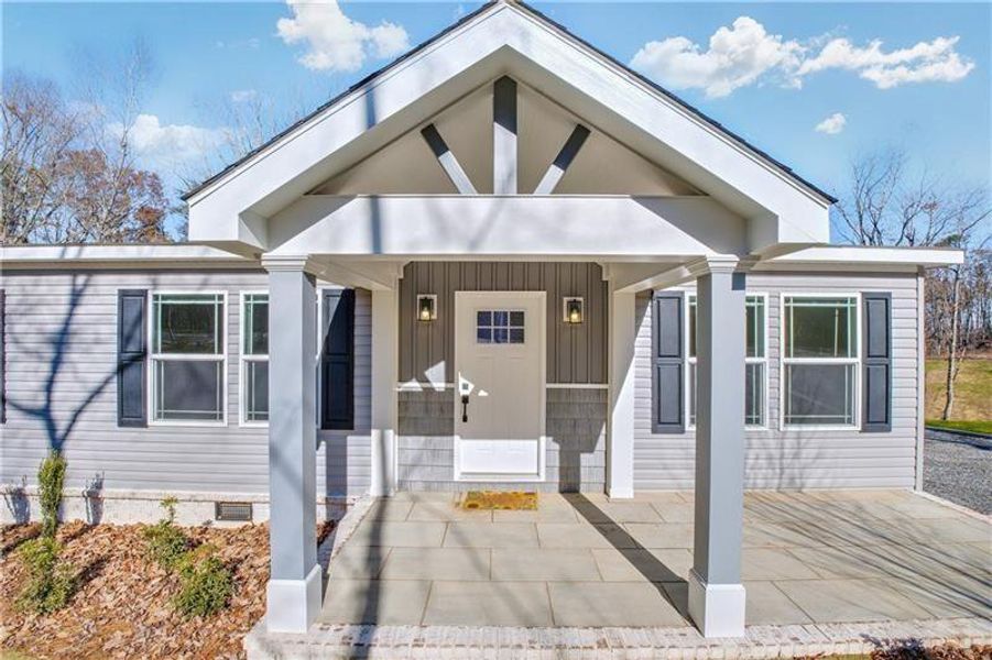 Front exterior of a new home in , Ball Ground, GA, highlighting curb appeal (Image 16).