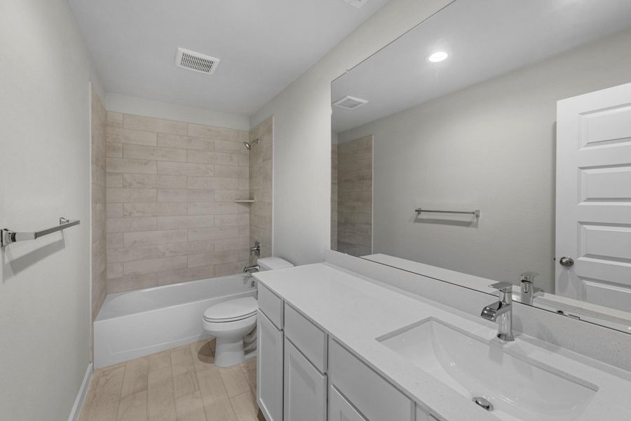 Furnished interior view inside a new home in Sunterra Lakes, Fulshear (Image 6).