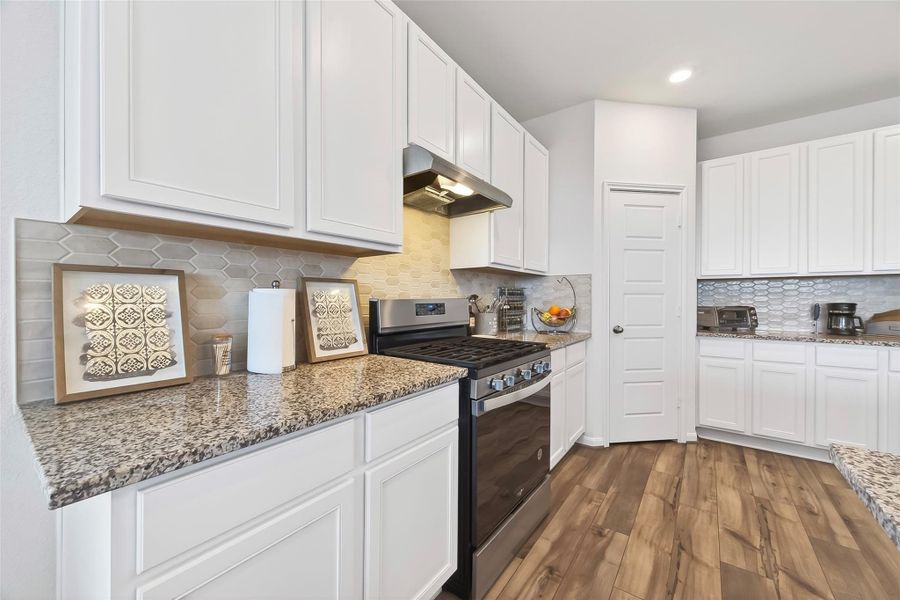 Kitchen features granite countertops