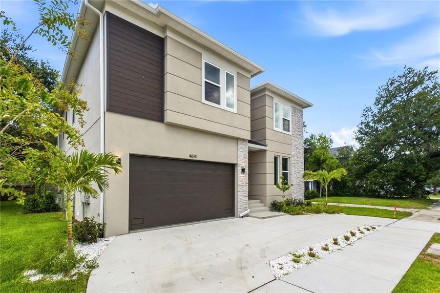 Front exterior of a new home in , Tampa, FL, highlighting curb appeal (Image 30).