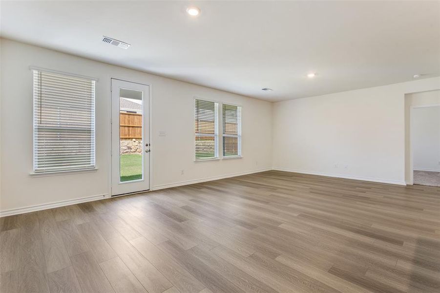 Spare room with light wood-style flooring and recessed lighting Spare room with light wood-style flooring and recessed lighting