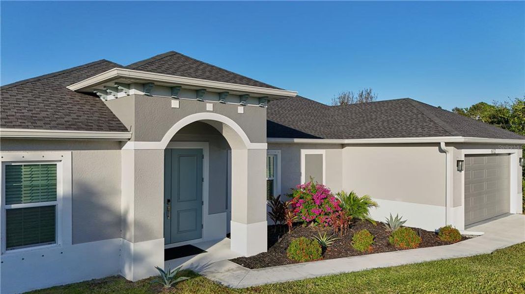 Front exterior of a new home in , North Port, FL, highlighting curb appeal (Image 2).