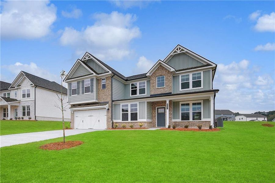 Front exterior of a new home in Grandview at Millers Mill, Stockbridge, GA, highlighting curb appeal (Image 2). Front exterior of a new home in Grandview at Millers Mill, Stockbridge, GA, highlighting curb appeal (Image 2).