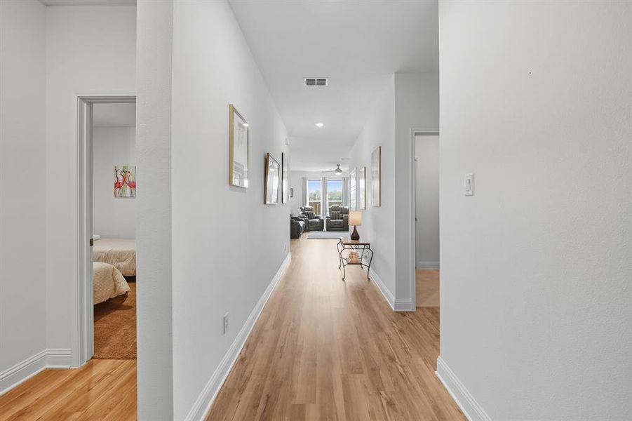 Corridor featuring light wood finished floors and recessed lighting Corridor featuring light wood finished floors and recessed lighting
