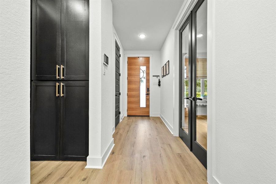 Custom black cabinets for secondary pantry and storage.