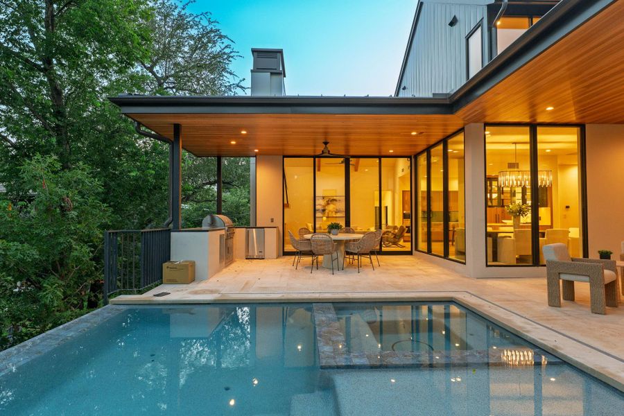 A spacious poolside patio and outdoor kitchen provide an ideal setting for entertaining. A spacious poolside patio and outdoor kitchen provide an ideal setting for entertaining.