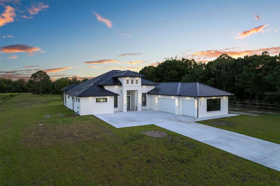 Front exterior of a new home in , Palm Bay, FL, highlighting curb appeal (Image 23). Front exterior of a new home in , Palm Bay, FL, highlighting curb appeal (Image 23).