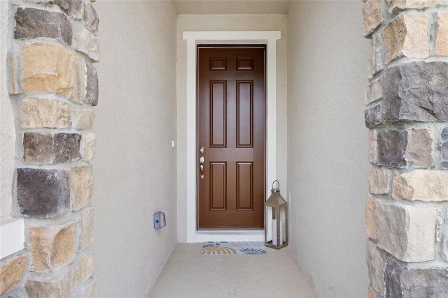 Exterior details and patio area of a home in Riverstone, Land O' Lakes (Image 19).